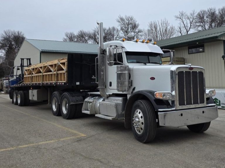 Lakeside Lumber Peterbilt semi loaded with framing trusses and Piggyback forklift at the Ashby yard