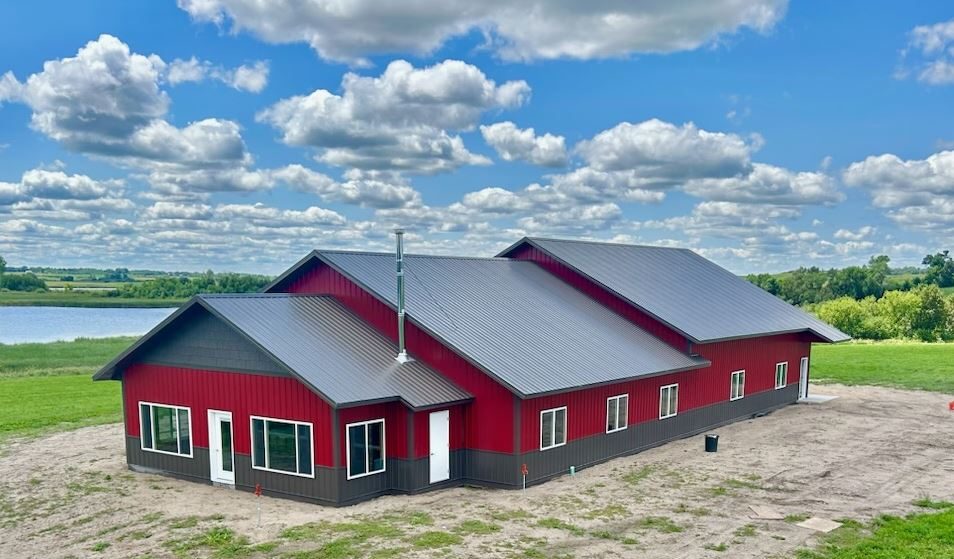 Standing seam steel roof in dark gray with cedar porch posts on custom home in Ashby, MN, supplied by Lakeside Lumber