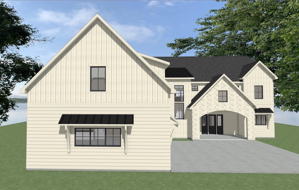 Side view of completed custom home on Otter Tail Lake with three-car garage and board and batten siding
