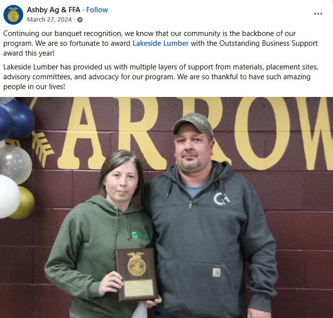 Mike and Heather Rossum of Lakeside Lumber holding the Ashby FFA Outstanding Business Support Award at the 2024 chapter banquet